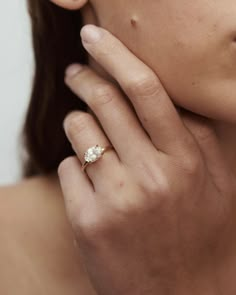 a close up of a person wearing a ring