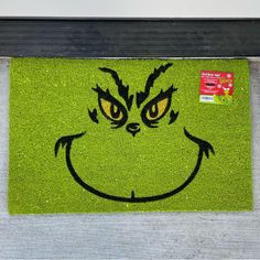 a door mat with the grin face drawn on it