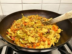 a pan filled with food on top of a stove