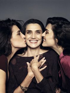 three women kissing each other on the cover of a magazine