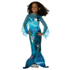 Your little girl will look fabulous under the sea when wearing the Magical Mermaid Toddler/Child Costume. This full length look is perfect for a cold Halloween night. The dress features an illusion neckline that matched the long flowing sleeves. Nautical designs are printed right onto the gown, ending in a tail fin. Halloween will go swimmingly this year when you order the Magical Mermaid Toddler/Child Costume today! Size: 2T-4T.  Color: Multicolor.  Gender: female.  Age Group: kids. Toddler Fish Costume, Princess Ariel Dress, Princess Dress Patterns, Mermaid Halloween Costumes, Fish Costume, Magical Mermaid, Mermaid Halloween, Voile Dress, Bubble Guppies