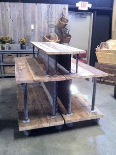 a wooden table sitting on top of a metal shelf