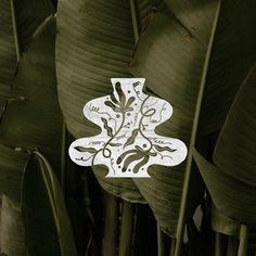 an intricately designed sticker on the side of a leafy plant