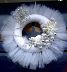 Beautiful Christmas door wreath. Comes with battery powered lights.  Looks great lit on dark winter evenings very festive. Silver Wreaths, Battery Powered Lights, Deco Mesh Wreaths Tutorials, Christmas Door Wreath, Silver Wreath, Mesh Wreath Tutorial, Battery Powered Light, Dark Winter