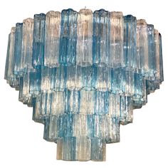 a large blue glass chandelier hanging from the ceiling