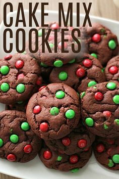 chocolate cake mix cookies on a white plate with green and red sprinkles