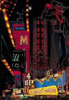 neon signs and buildings lit up at night in las vegas, nv on the las vegas strip