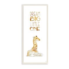 a giraffe sitting on top of a white floor next to the words dream big little