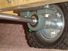 a close up view of the wheel on a vehicle's rear tire and axle