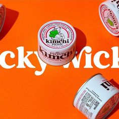 three yogurts are sitting next to each other on an orange background with the words lucky nick