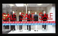 a window display with mannequins in front of it that says sale sale