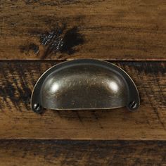 an old wooden drawer with a metal handle