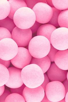 pink candy balls are shown in close up