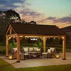 a covered patio area with furniture and lights