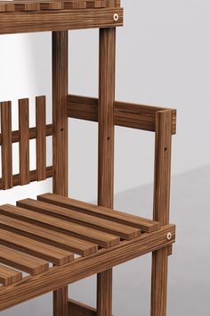 a wooden chair sitting on top of a white floor