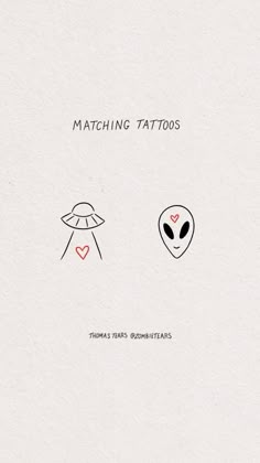 two alien heads with hearts on them and the words matching tattoos written in black ink