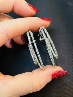 Featuring a gorgeous pair of natural diamond hoops in solid 18K white gold. The diamonds are totalling 2 carat weight.  Approximatel K L color, and SI1 clarity. the earrings are 1.5" long with leverback closures Not marked, acid tests for solid 18K white gold  13.6g grams in total  Very good condition Dazzling Diamond Cut White Hoop Earrings, Diamond-cut Dangle Hoop Earrings In Diamond, Dazzling Diamond-cut Diamond Hoop Earrings, White Round Clip-on Diamond Earrings, Dazzling Diamond-cut Hoop Earrings In White Gold, Inside Outside, Diamond Hoop Earrings, 2 Carat, Jewelry Earrings Hoops