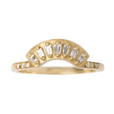 a yellow gold ring with white stones