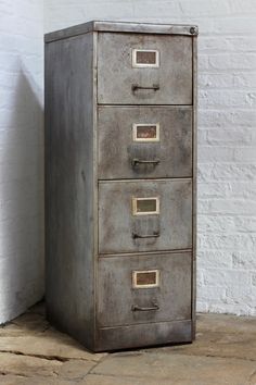 an old metal filing cabinet with five drawers