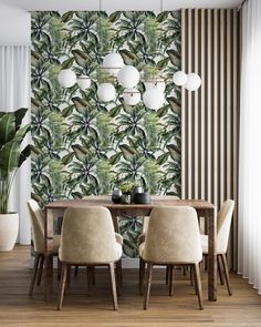 a dining room with a table and chairs in front of a wallpapered background