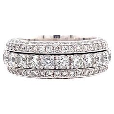 5 Row Spinning Diamond Eternity Band Style: 5 Row Spinning Metal: 18 kt White Gold Size: 8 Measurements: 7 MM Wide X 3 MM Height Weight: 15.30 grams TCW: 4.55 tcw Main Diamond: 188 Round Brilliant Diamonds Color & Clarity: G - H, SI1 Cut: Excellent Hallmark: TA Au750 4.55CTW Includes: Certified Appraisal - Elegant Ring Box Retail: $15,000 Sku#13810TSD091021-8 Yellow Gold Diamond Eternity Band With Multi-stone, Type Of Relationship, Diamond Eternity Wedding Band, Hand Rings, Wedding Outfit Ideas, The Life I Want, Diamond Eternity Band, Right Hand Rings, Life I Want