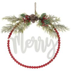 a red beaded christmas ornament with pine cones, berries and evergreen leaves