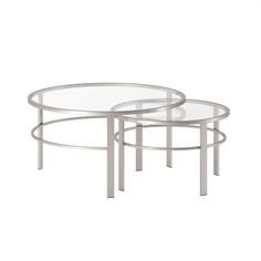 three tables with glass tops and metal legs, one on each side by the other