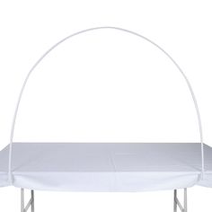 a white bed frame with an arch on top