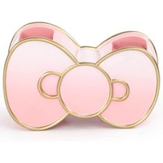 a pink and gold brooch with two teddy bears on the front, one is shaped like a bow