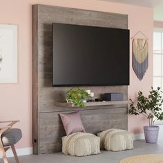 a flat screen tv mounted to the side of a wall