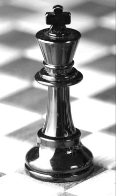 a black and white photo of a chess piece