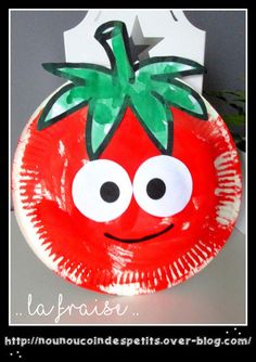 a paper plate with a tomato painted on it