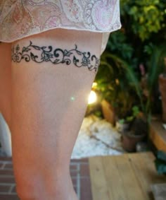 a woman with a tattoo on her leg