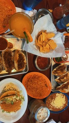 a table filled with lots of food and condiments on top of each other