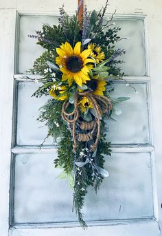 a sunflower wreath hangs on the front door