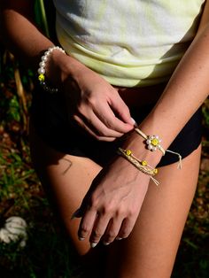 Make every day a blooming success with our Mini Happy Flower Bracelet! Featuring a smiley flower charm, this bracelet looks seriously good - happy vibes guaranteed! 6" Adjustable white threadwork Drawstring closure (extendable up to 8") Gold plated brass hardware Freshwater Pearls Ceramic Charms Handmade in New York City and Puerto Rico. Due to the handmade nature of our products, some charms may vary in color and style or be replaced if unavailable. Please allow 5-7 business days for production Smiley Flower, Ceramic Charms, Happy Flowers, Happy Vibes, Hair Rings, Flower Bracelet, Flower Charm, Brass Hardware, Diy Kits