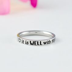 "* This listing is for one stainless steel band ring, engraved with the uplifting phrase \"it is WELL with my SOUL\" and featuring heart symbols before and after the text, this ring is perfect for any Christian looking for a daily reminder of their faith. * Whether you're treating yourself or buying a gift for a friend, this ring is the perfect way to add a touch of faith to any outfit. Materials & Features: * The ring is made of premium quality, hand-polished solid stainless steel, which is hyp I Refuse To Sink, Best Graduation Gifts, Refuse To Sink, Be Still And Know, It Is Well With My Soul, Sorority Sisters, Heart Symbol, Stacking Bands, Fade Out