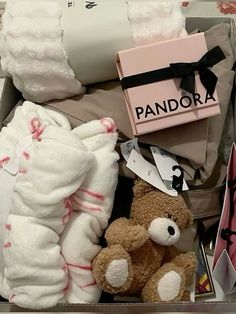 a box filled with lots of diapers and stuffed animals