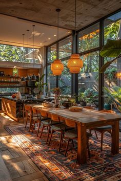 the dining room table is surrounded by plants and potted plants in front of large windows