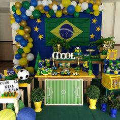 a soccer themed party with balloons and decorations