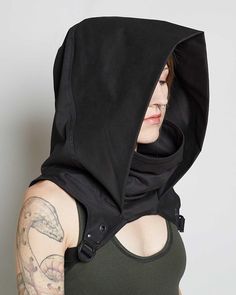 Slip unnoticed into the shadows with the Rogue Cowl. Made from heavy duty cotton twill and accented with sleek metal hardware, this cowl is both lightweight and incredibly durable. The perfect accessory for any night of nefarious doings. Our new design provides a better fit for Cyberpunk Mode, Style Cyberpunk, Goth Hoodie, Gothic Mode, Fest Outfits, Cyberpunk Fashion, Cyberpunk Style, Futuristic Fashion, Fantasy Clothing