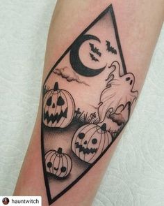 a black and white halloween tattoo with pumpkins