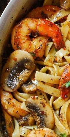 pasta with shrimp and mushrooms in a pan