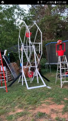 several different types of metal structures in the grass