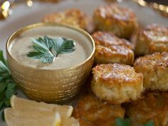 some food is sitting on a plate and garnished with green leafy leaves