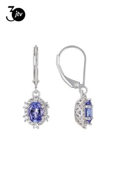 1.29ctw Oval Tanzanite With 0.35ctw Round White Zircon Rhodium Over Sterling Silver Dangle Earrings. Measures Approximately 1.02"L x 0.32"W. Leverbackings. Accent stones primarily zircon. Blue Tanzanite, Silver Dangle Earrings, Sterling Silver Dangle Earrings, Silver Earrings Dangle, Dangle Earrings, Sterling Silver, Stone, Silver, Blue