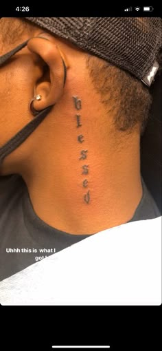 the back of a man's neck with words written on it