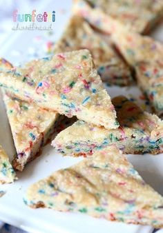 colorful sprinkles are on top of white crackers