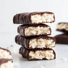 several pieces of chocolate with coconut on top