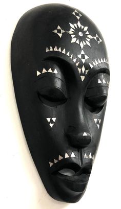 "Height: 9.5\" Width: 5.5\" Mask is in good previously owned condition. Mother of pearl inlay. **Please keep in mind we do obtain most of our items from estate sales. We don't know if our items have been exposed to smoke, pets, mold or any other environmental irritants. Once we have the items, they are stored free from smoke, pets, and mold** Please look at all of the pictures as they are part of the description. If you have any questions or need more pictures please message us." Masks On Wall, Wall Of Masks Decor, Face Mask Wall Hanging, Artistic Handmade Black Masks, Wooden Mask Wall Decor, More Pictures, Halloween Face Makeup, Mask, Wall Hanging